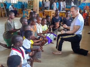 Africa kids make a tkd fist with Master Dean