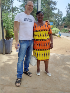 Dean stands with wafrican woman